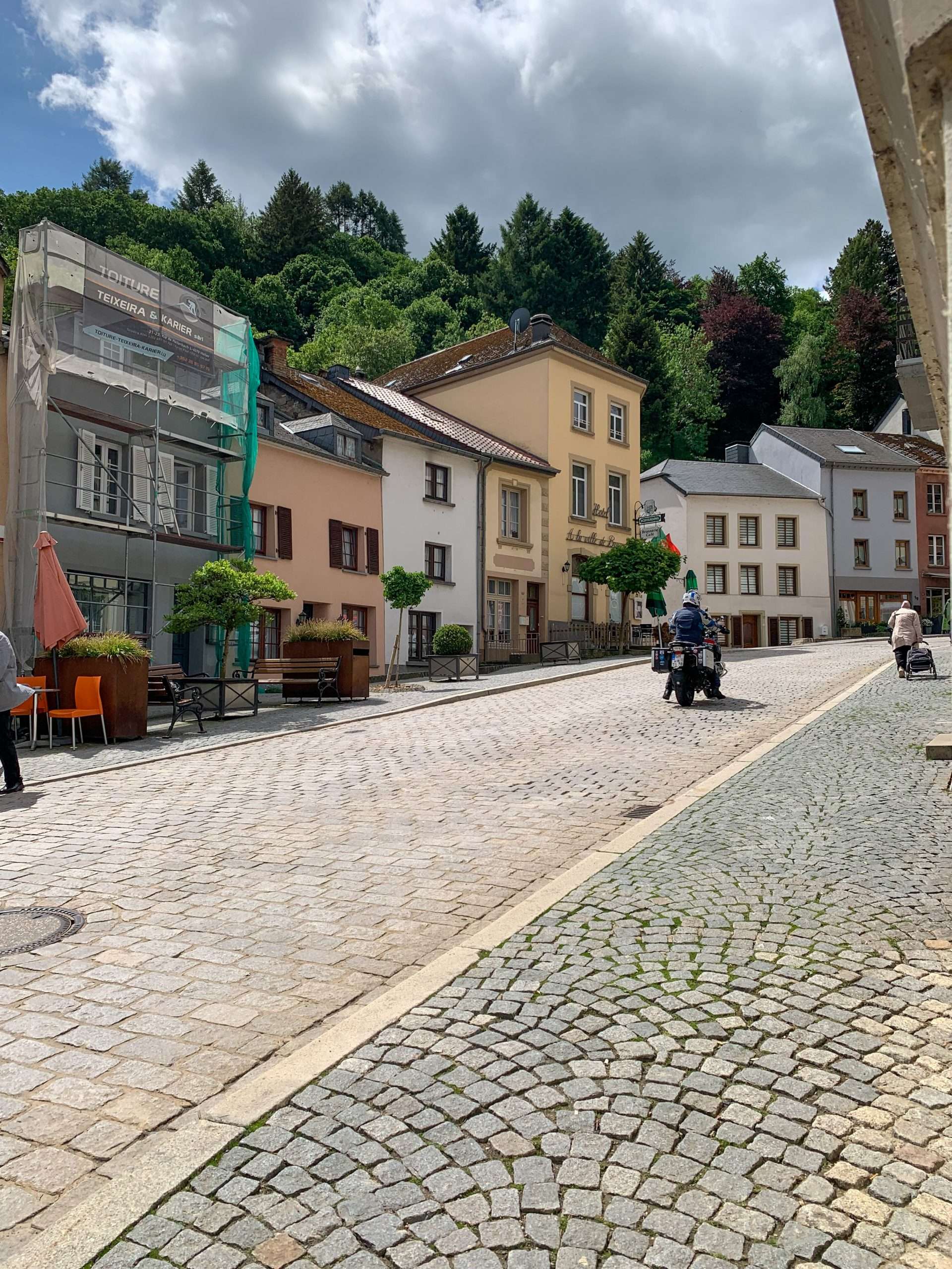A street scene in Vianden, Luxembourg. The road leads up to Vianden Castle.