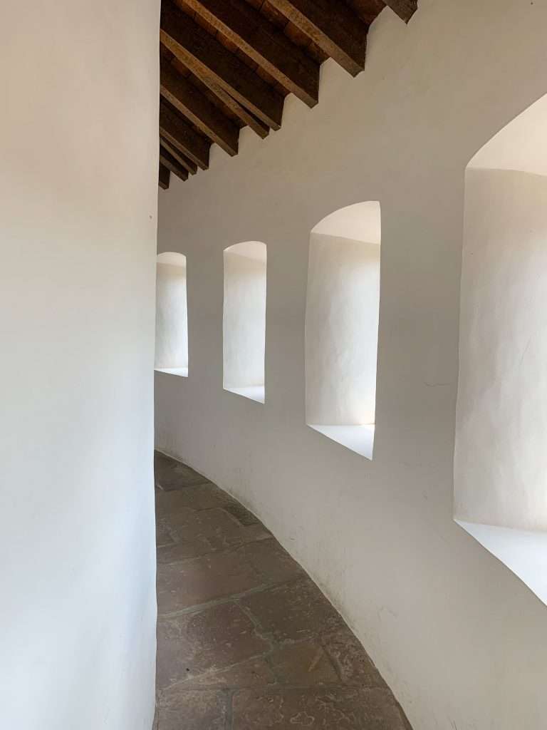 A view of the Chemin de Rhonde, a curved hallway, inside Vianden Castle in Luxembourg