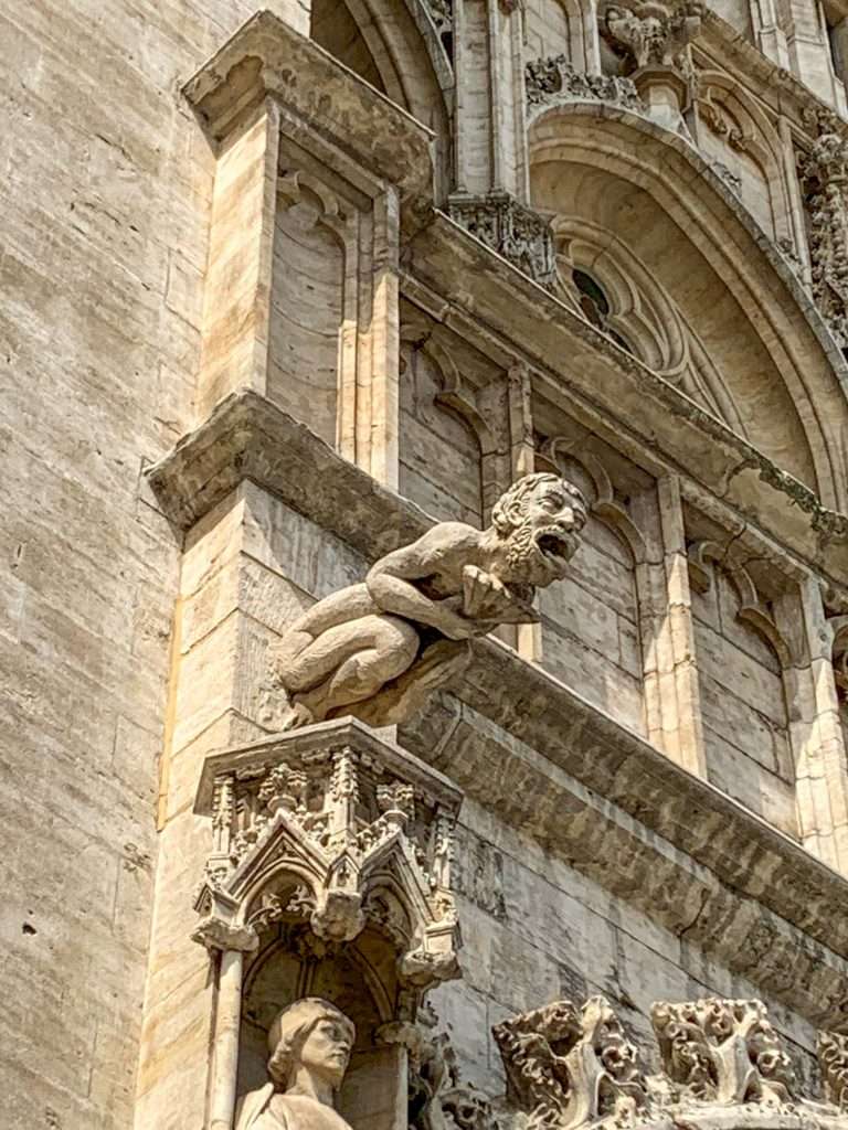Image shows a gargoyle on the façade of the Town Hall in the Grand Place in Brussels 
