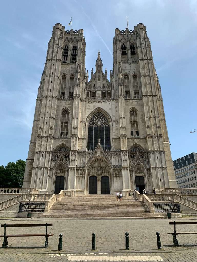 Image shows the towering Roman Catholic Cathedral of St Michael & St Gudula in Brussels. A place to stop when spending 1 day in Brussels. 