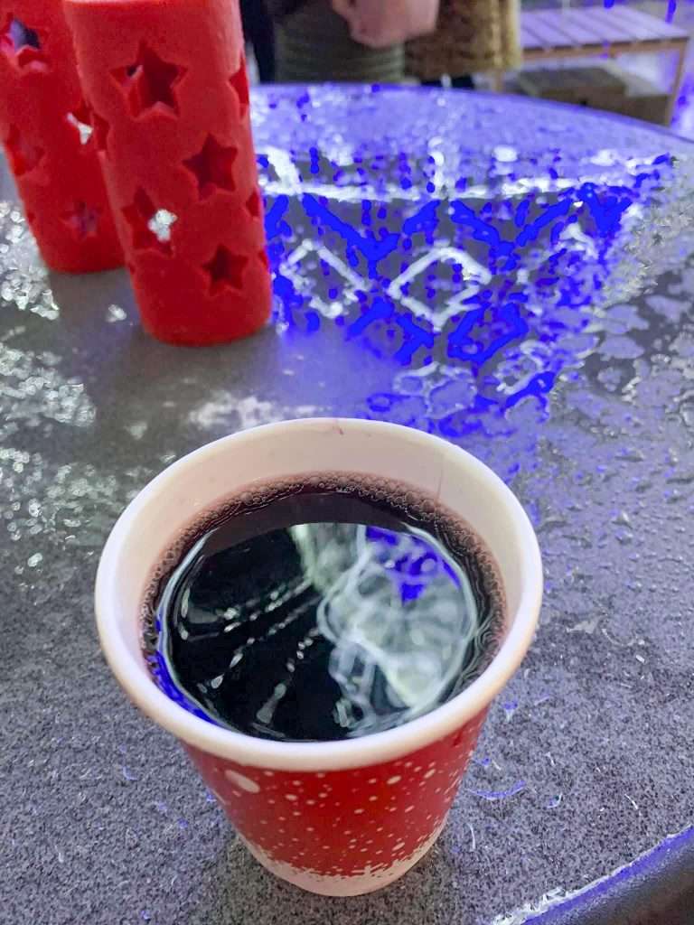 Image shows a cup of mulled wine consumed and enjoyed by the author of this blog post when visiting Vilnius in December.