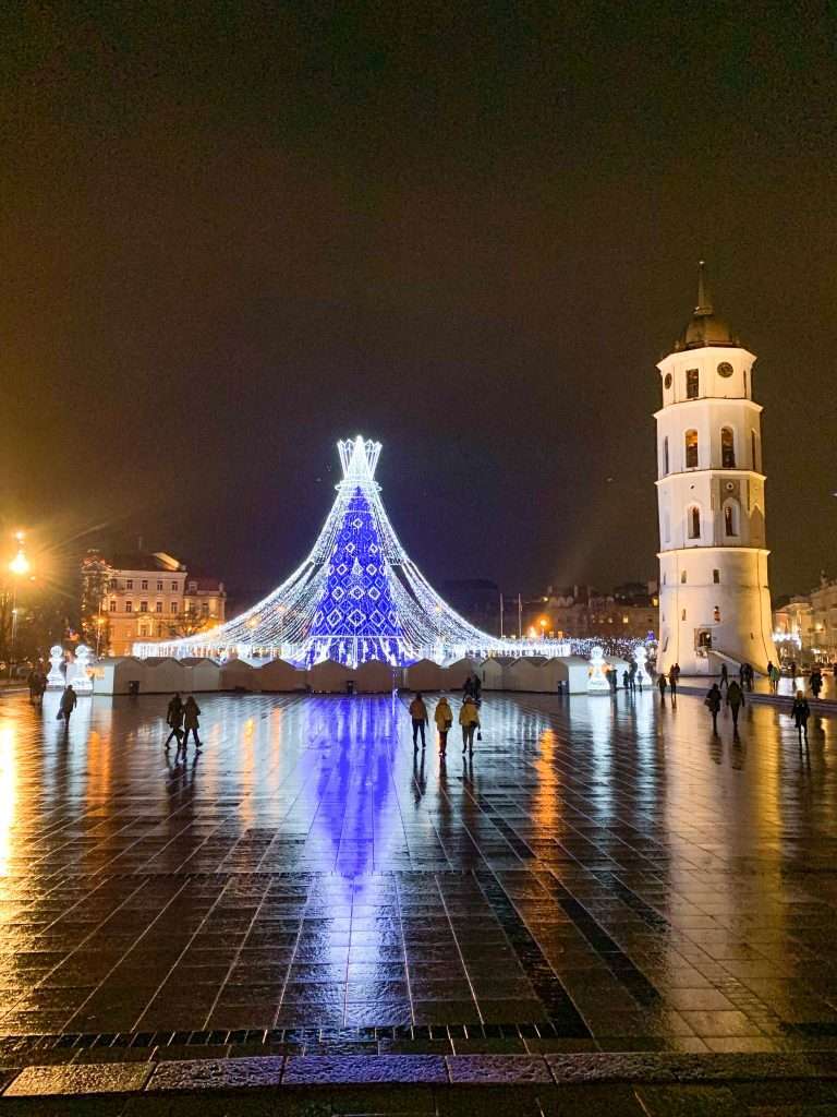 Image shows the 2019 Christmas tree located in Cathedral Square in Vilnius. Also visible in the image is the Bell Tower