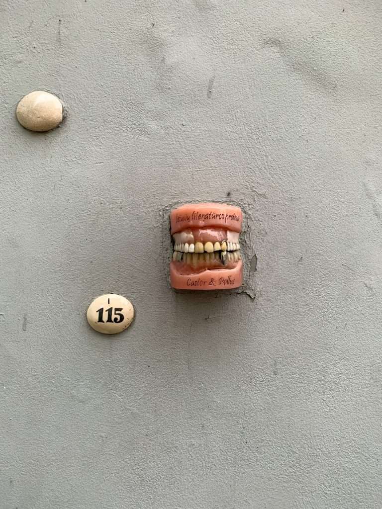 Image shows what some teeth and gums forming part of the street art along Literatai Street in Vilnius