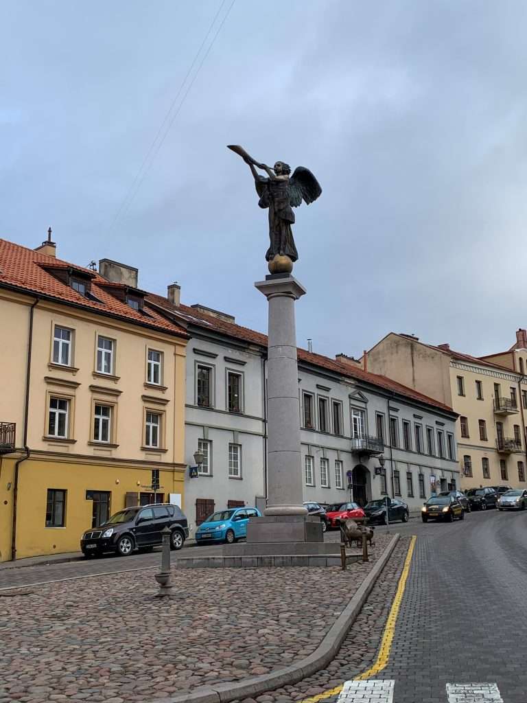 Image shows a statue called the Angel of Užupis located within the neighbourhood known as the Republic of Užupis in Vilnius