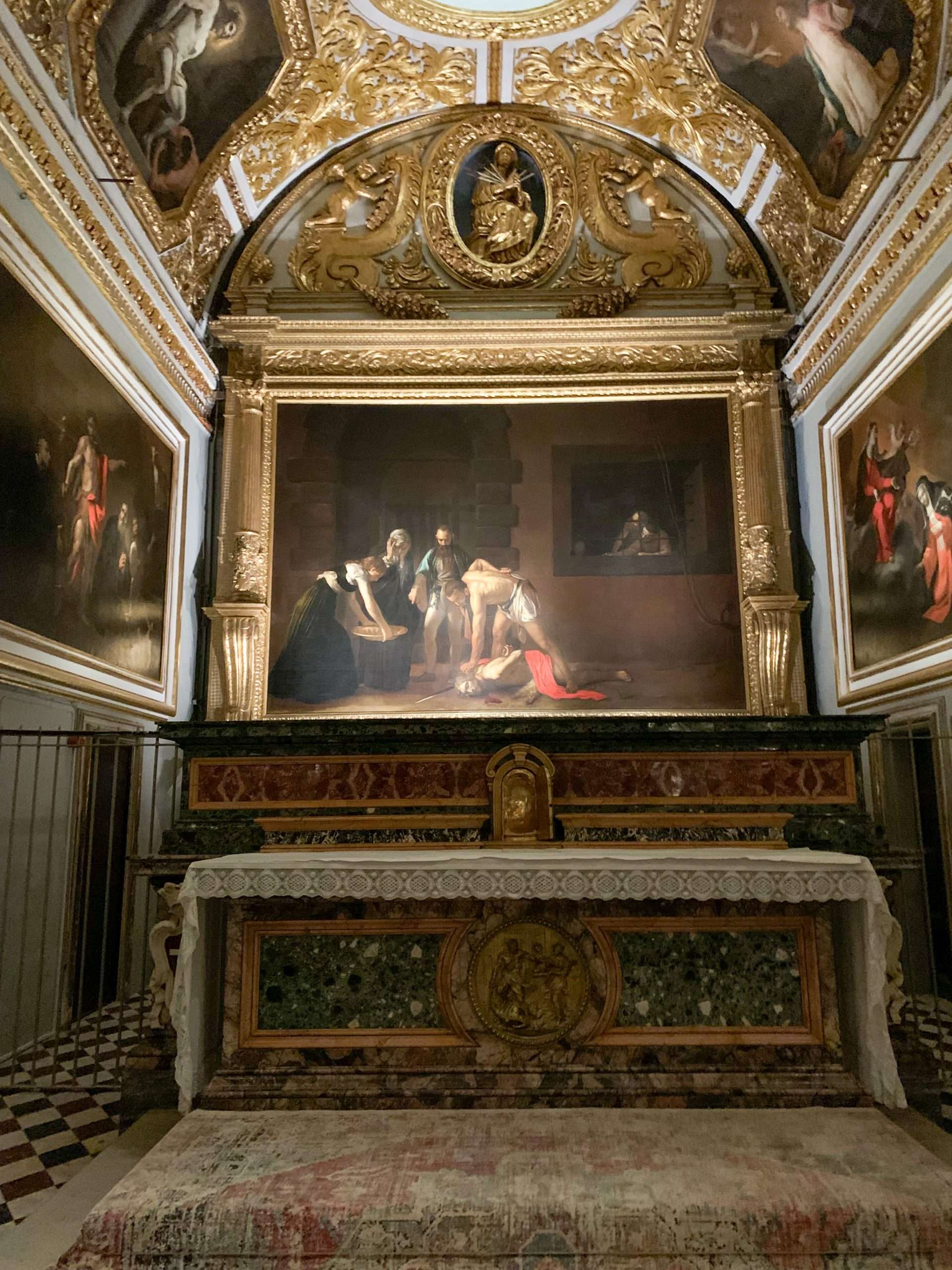 Caravaggio's painting of the Beheading of St John the Baptist hanging inside St Johns Co-Cathedral, Malta.