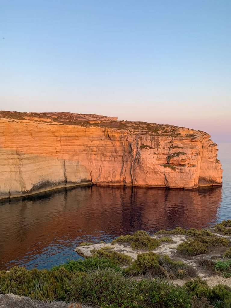 A view of the Xlendi coastline in Malta. Hiking along the coastline is one of the reasons to visit Malta.