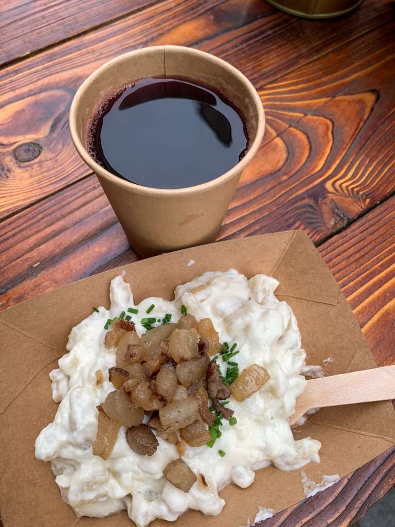 Image shows traditional Slovakian potato dumplings and some mulled wine, all consumed during 3 days in Bratislava