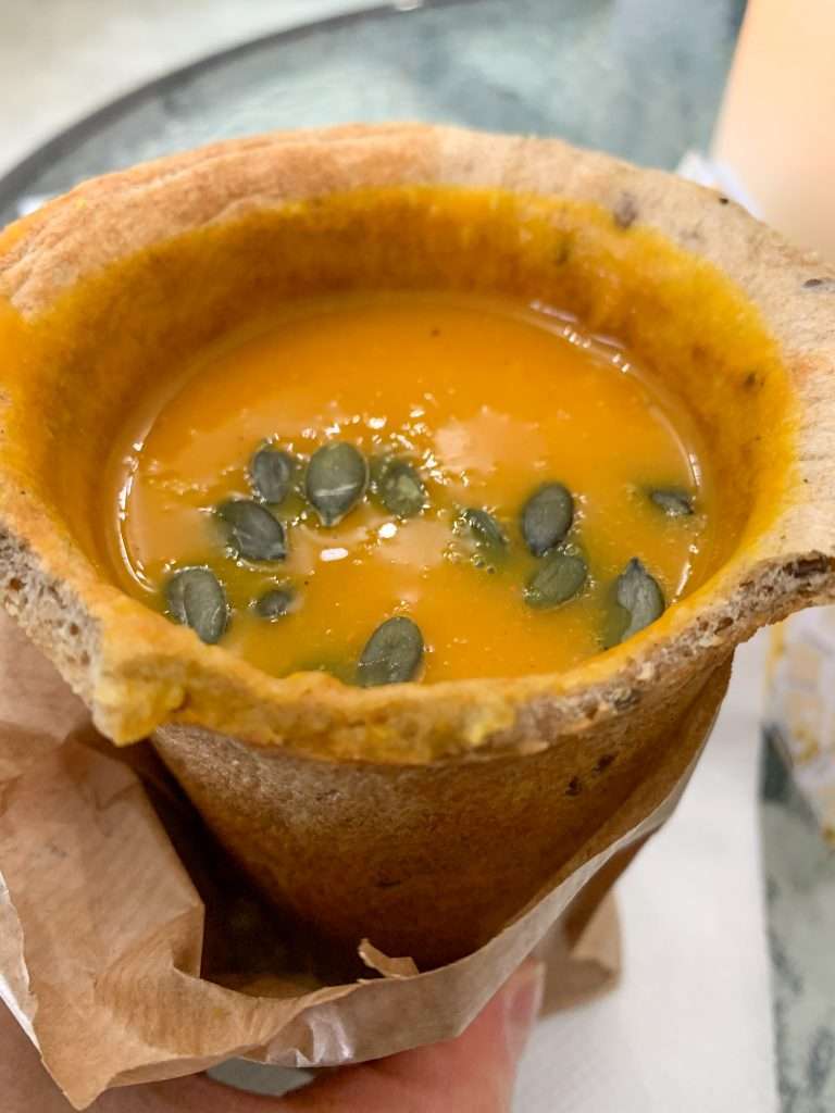 Image shows soup in an edible cup purchased from Soup Culture in Bratislava. It was a delicious and filling meal!