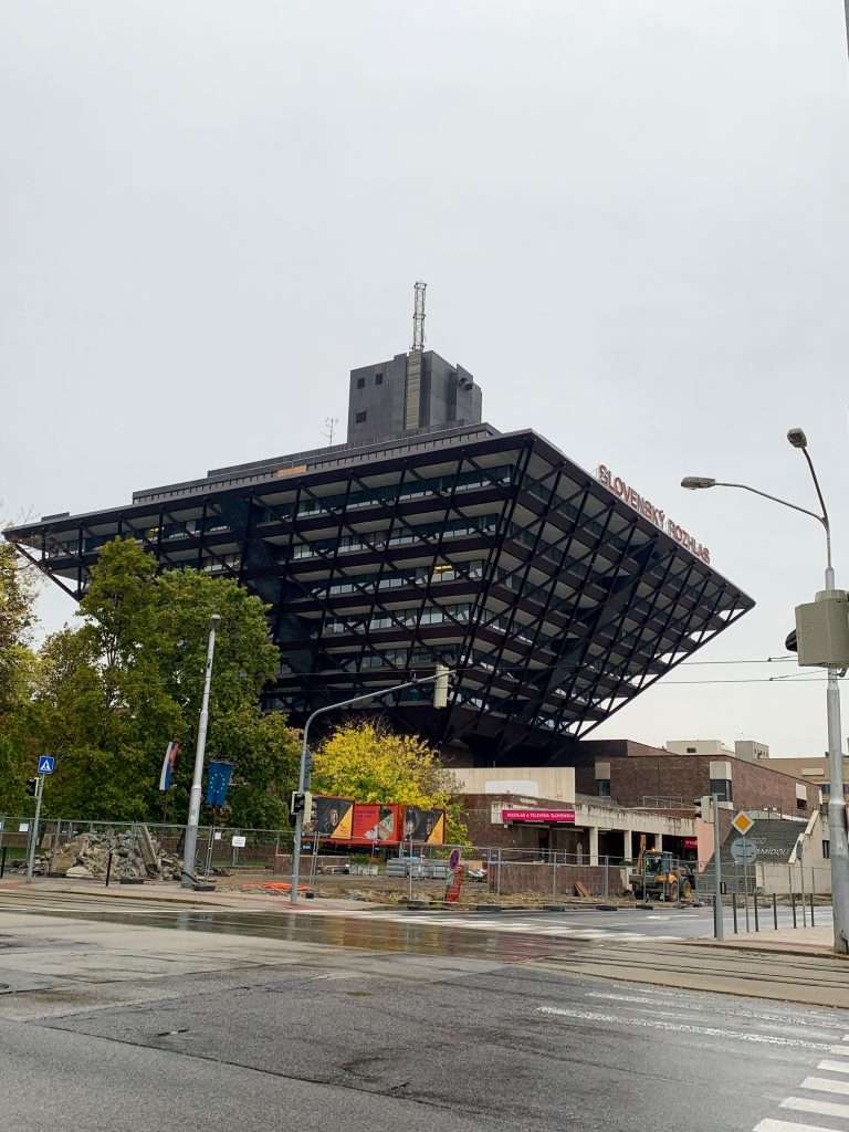 Image shows the Radio Station Building in Bratislava. It looks like an upside down pyramid.