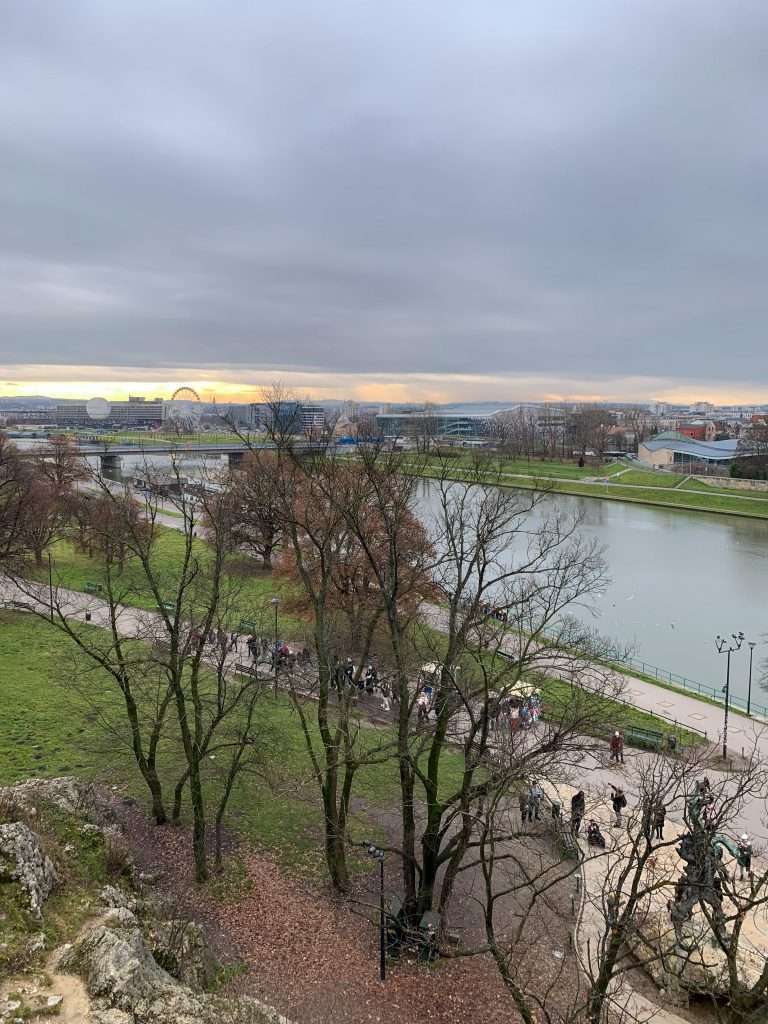 Image shows a view of the Vistula River running through Krakow