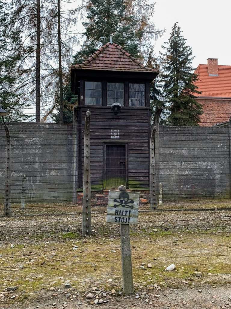 Watch towers are a brooding presence during your unforgettable visit to Auschwitz