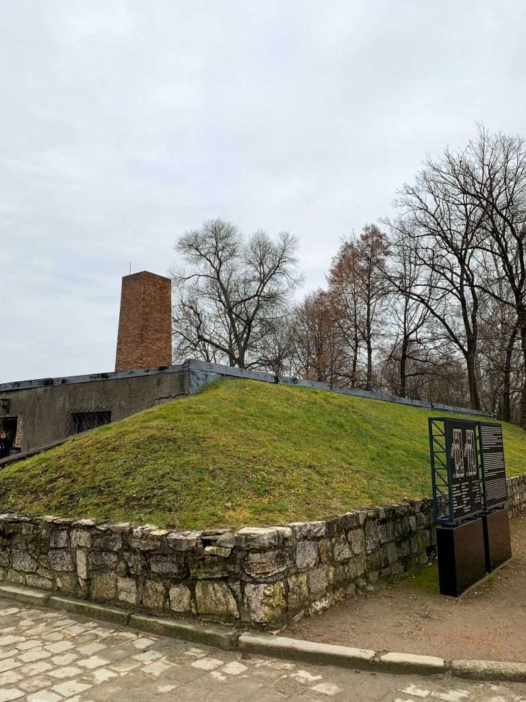 Image shows the unforgettable view of a crematorium at Auschwitz