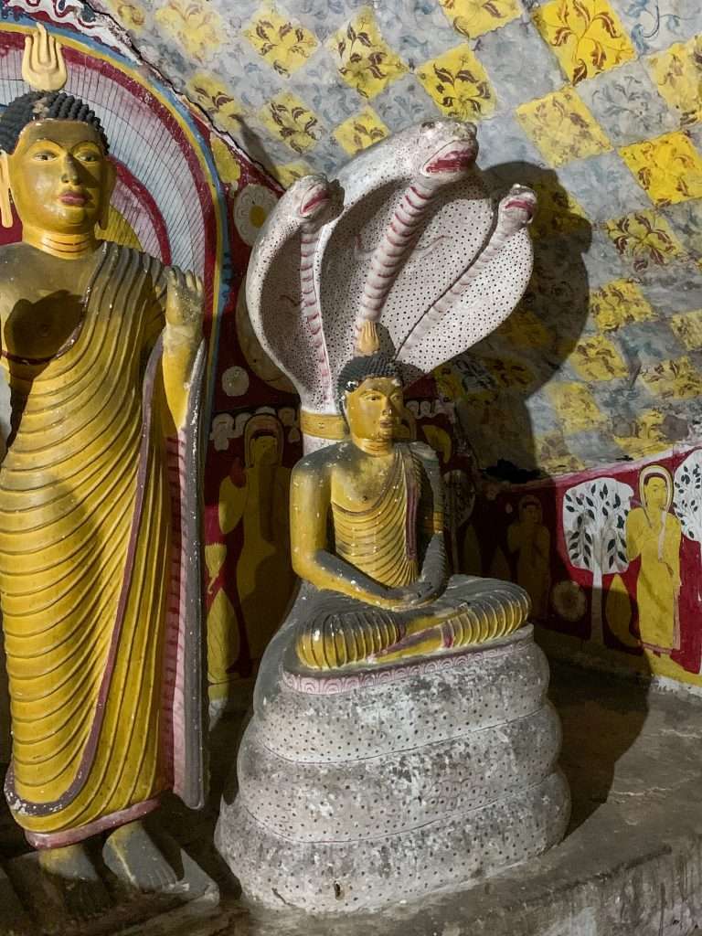 Image shows one of the many beautiful statues of Buddha within the Dambulla Cave complex.
