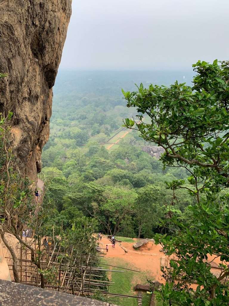 Image shows the view from the top of Lion Rock in Sri Lanka looking down over the countryside.