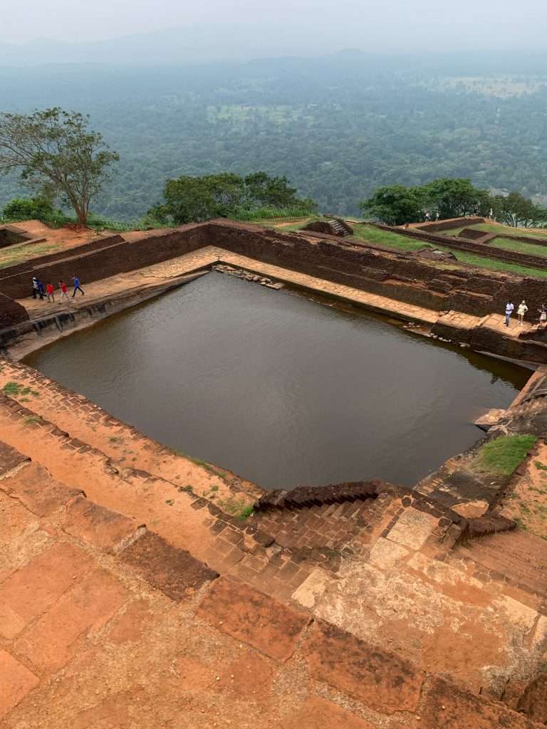 Image shows a pool at the Rock Fortress at Sigirya. A visit here is one of the best things to do in Sri Lanka  
