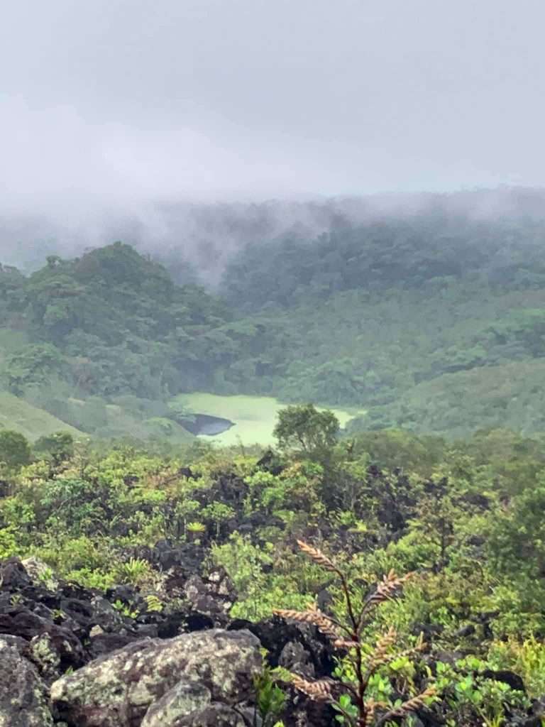 Image shows a view of the Arenal volcano region although the mist is low and the view limited!