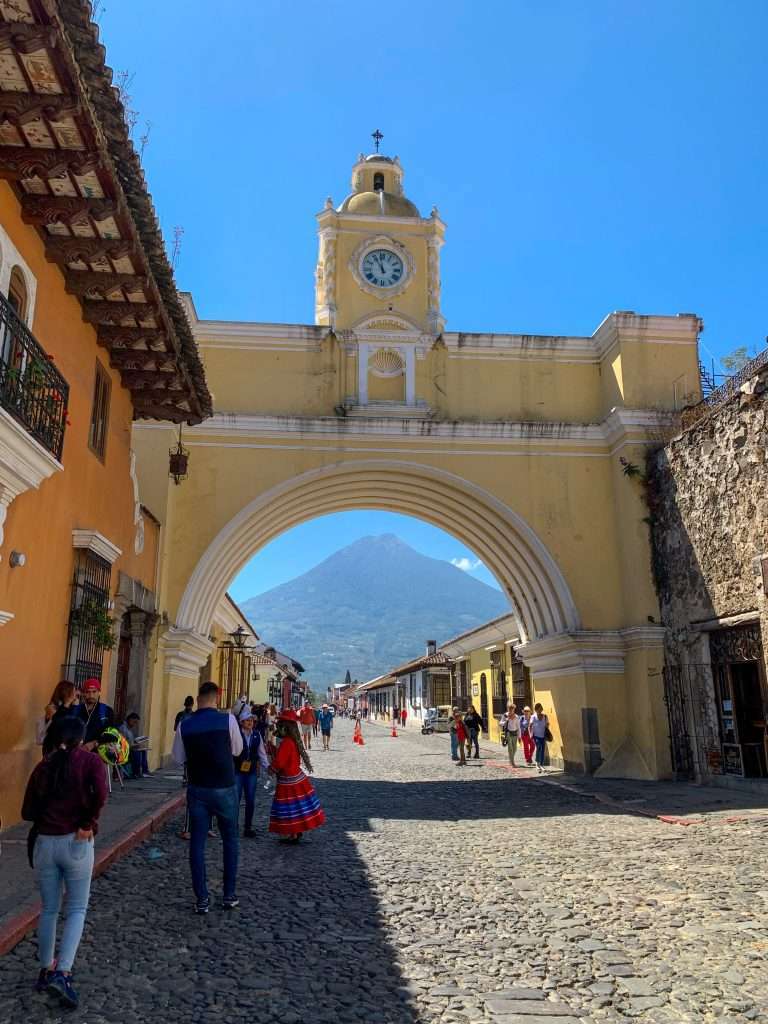 Image shows the famous Santa Catalina Arch in Antigua Guatemala. This is a must visit site when spending a day in Antigua