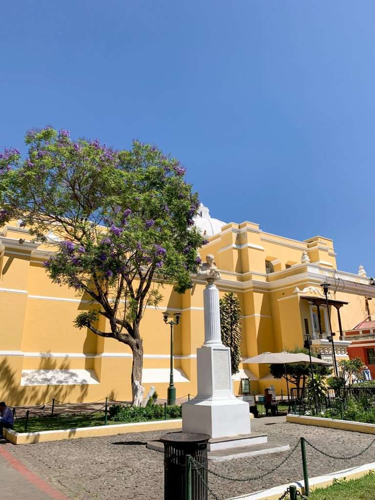 Image shows a side view of La Merced Church in Antigua Guatemala. This is a must visit site when spending a day in Antigua