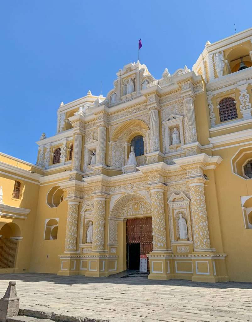 Image shows La Merced Church in Antigua Guatemala. This is a must visit site when spending a day in Antigua
