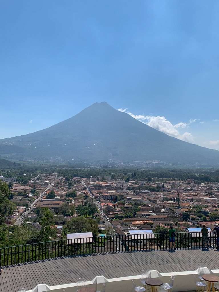 Image shows the view of the Agua volcano from the Cross on the Hill. Hiking up to the Cross is one of the best things to do in Antigua Guatemala.