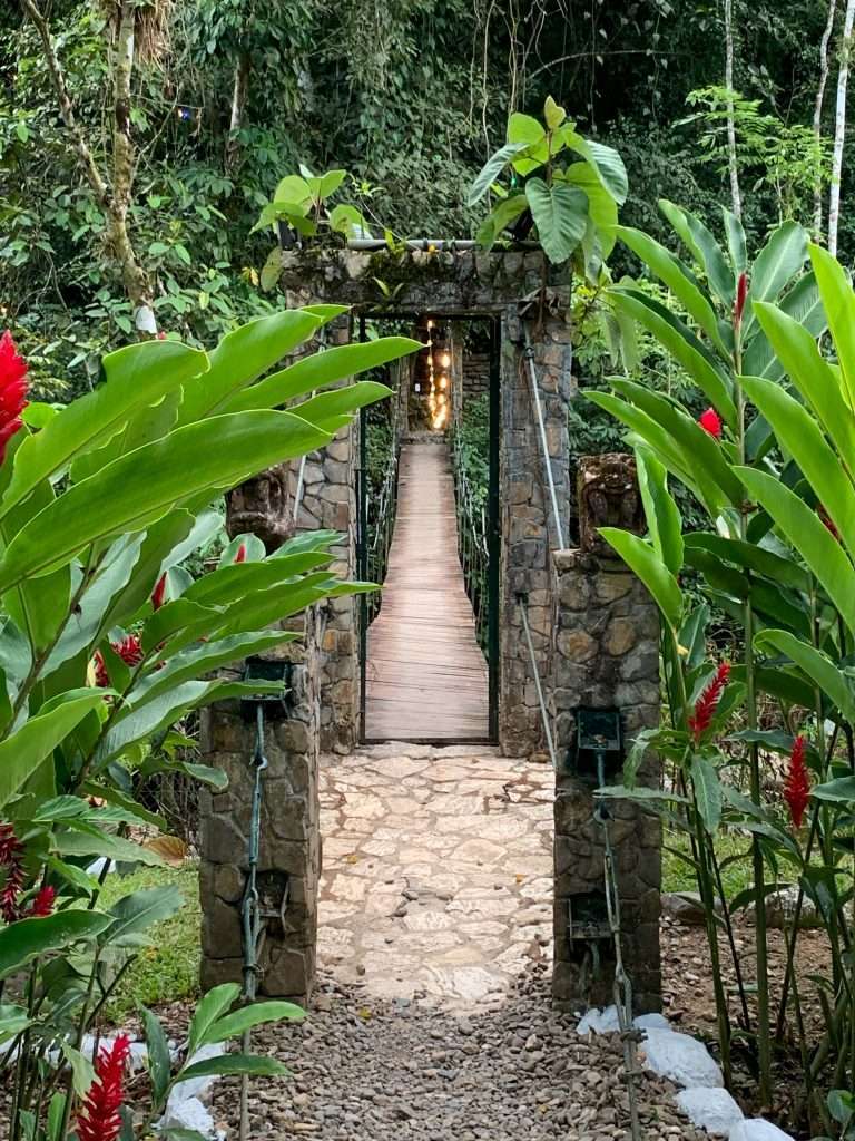A swing bridge leads visitors into the Luna Jaguar Hot Springs, a must visit when visiting Copán Ruinas in Honduras