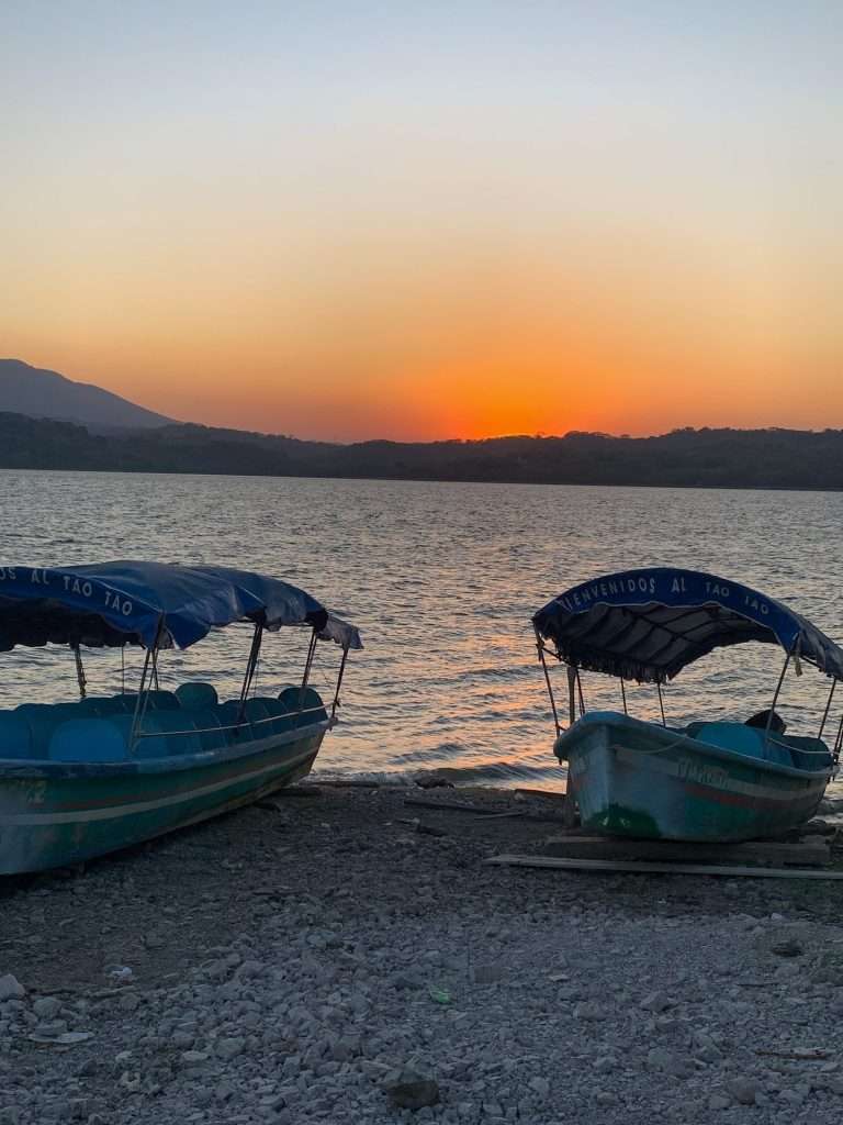 Boats are tied up on the shores of Lake Suchitlán in Suchitoto El Salvador