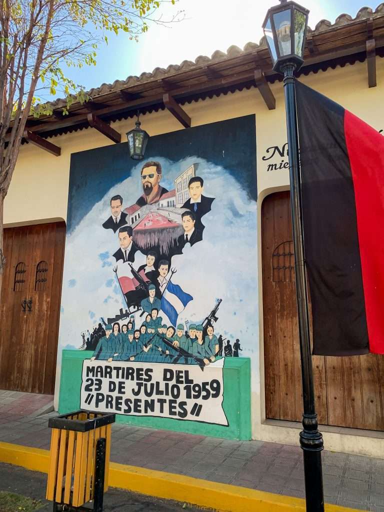 Street art in León featuring images of people and political themes.