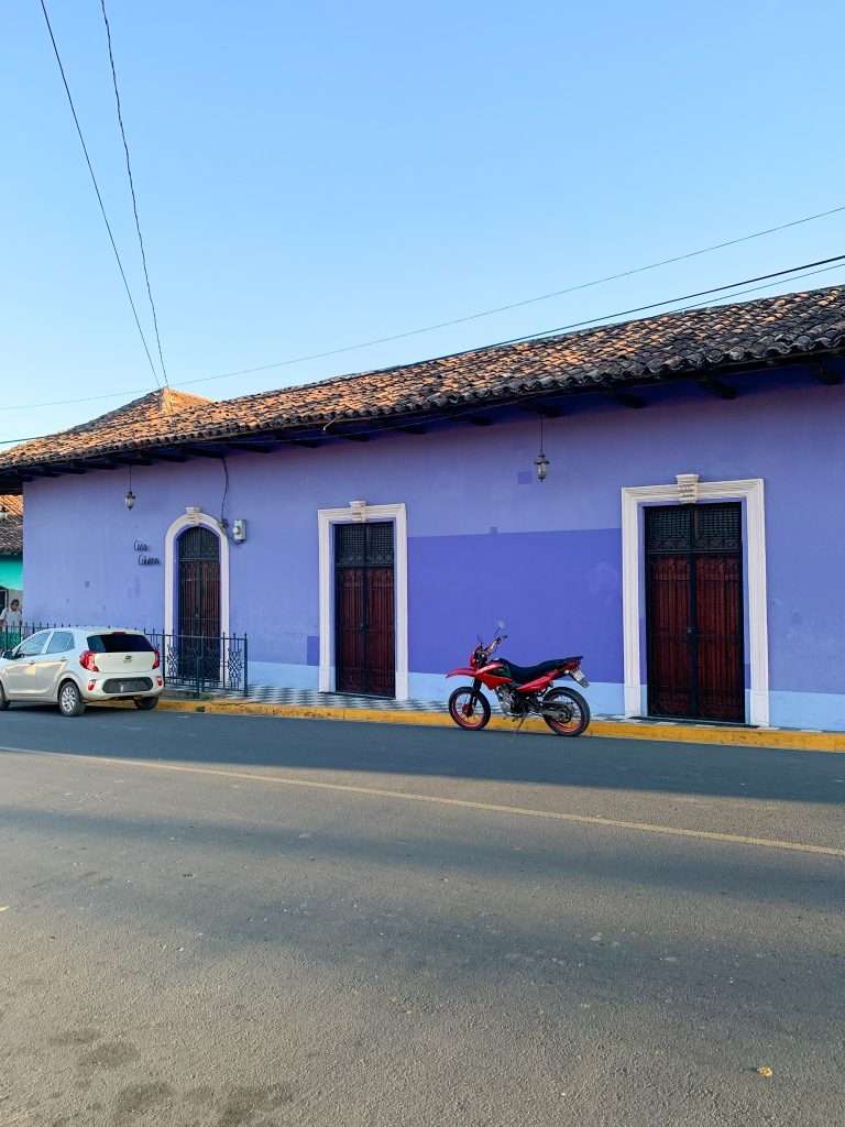 A purple coloured building in Granada Nicaragua is just one of the many brightly coloured buildings visitors to Granada will see.