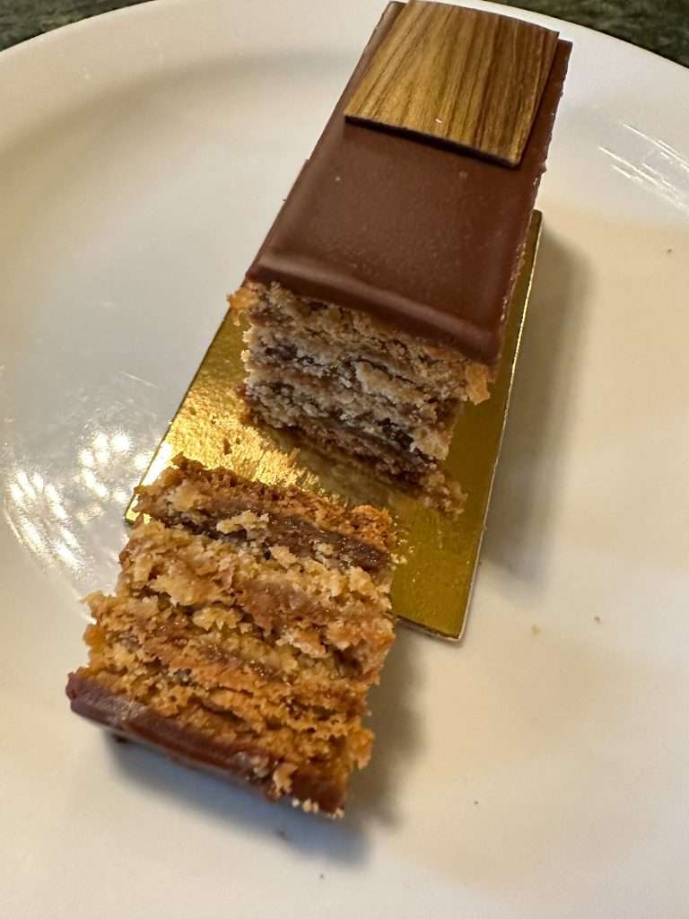 A Gerbeaud Slice lies on a white plate.