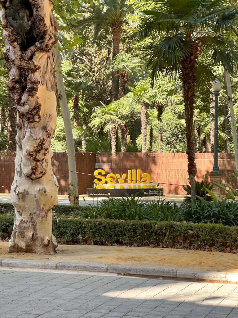 Image shows a sign of Seville seen during a walking tour of the city - definitely one of the best things to do in Seville. 