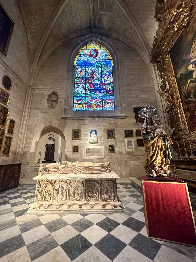 Image shows a tomb within Seville cathedral