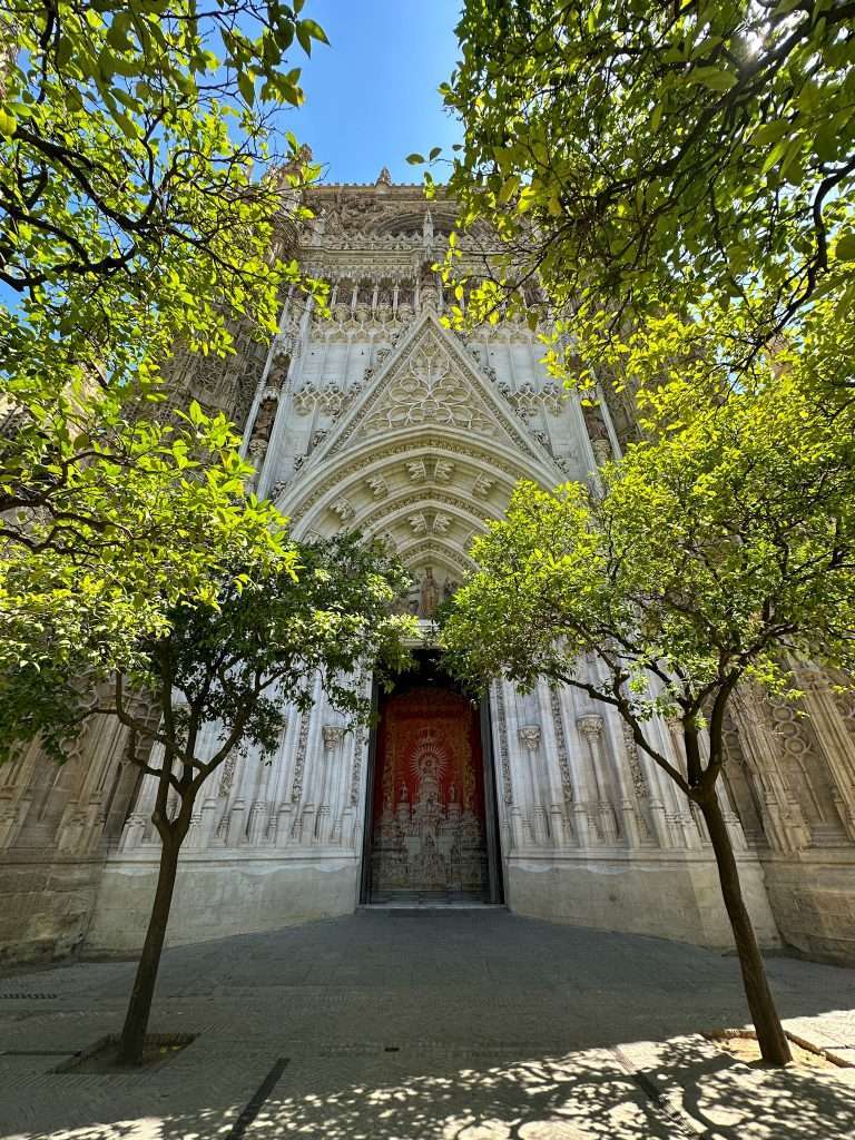 Image shows one of the doorways into Seville Cathedral - one of the best things to do in Seville