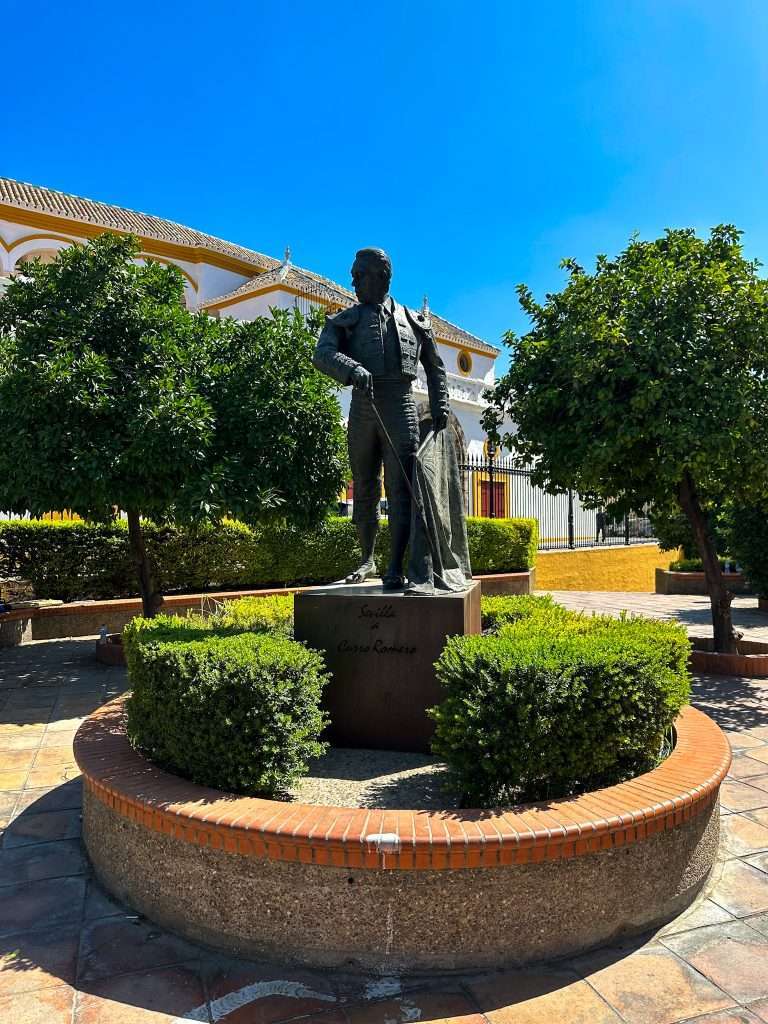 Image of a statue of a matador outside the bullring in Seville. Taking a tour of the bullring is one of the best things to do in Seville. 