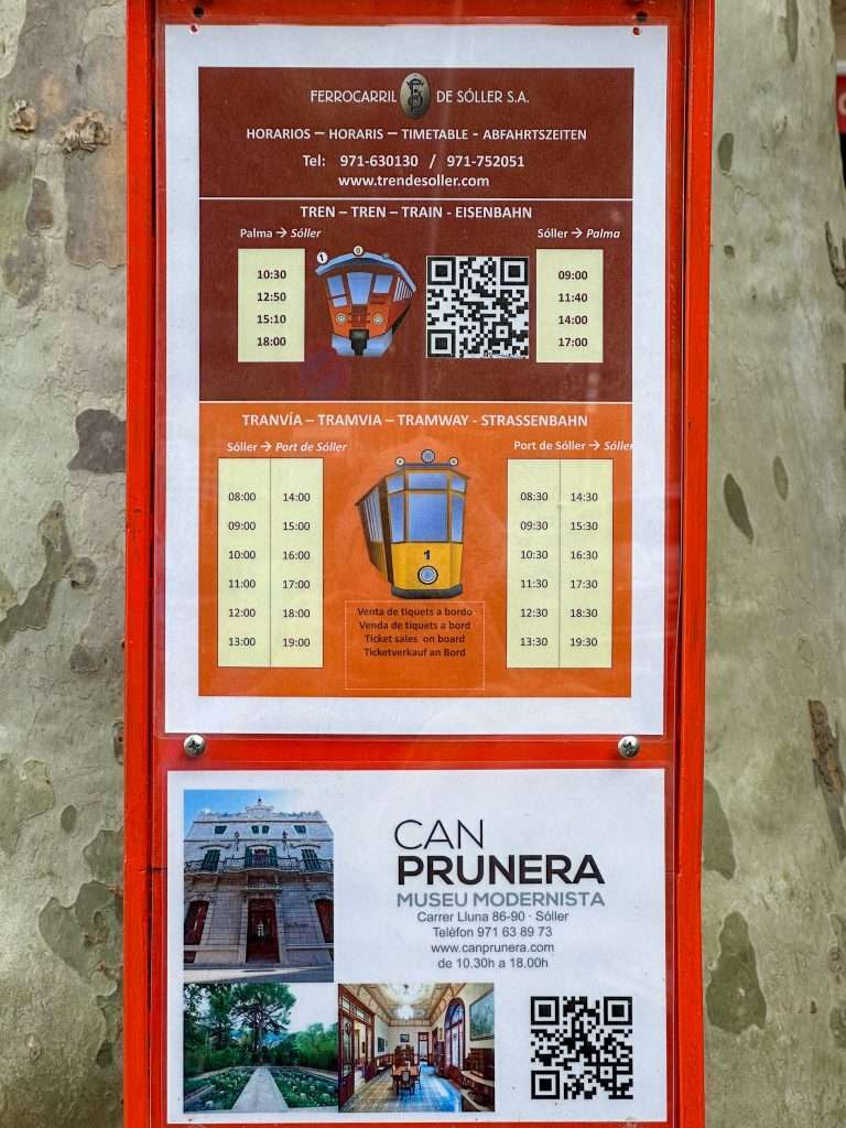 The timetable for the tram to Port de Soller located outside main train station in Soller.