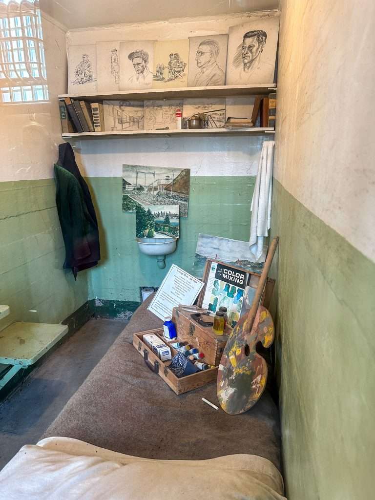 A cell on Alcatraz together with art accessories such as paints and brushes which some inmates used to pass the time. 