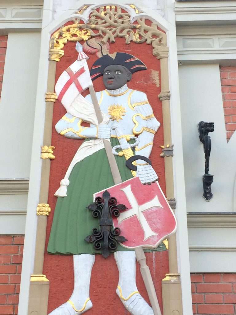 Image shows a close up view of one of the Patrons of the Blackheads, St Maurice. His statue is embedded on the wall of the House of the Black Heads in the Old Town in Riga.