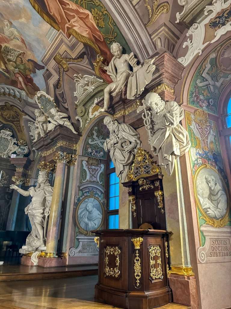 Image shows some of the statues and decoration inside the Aula Leopoldina, a baroque hall indie Wroclaw University.