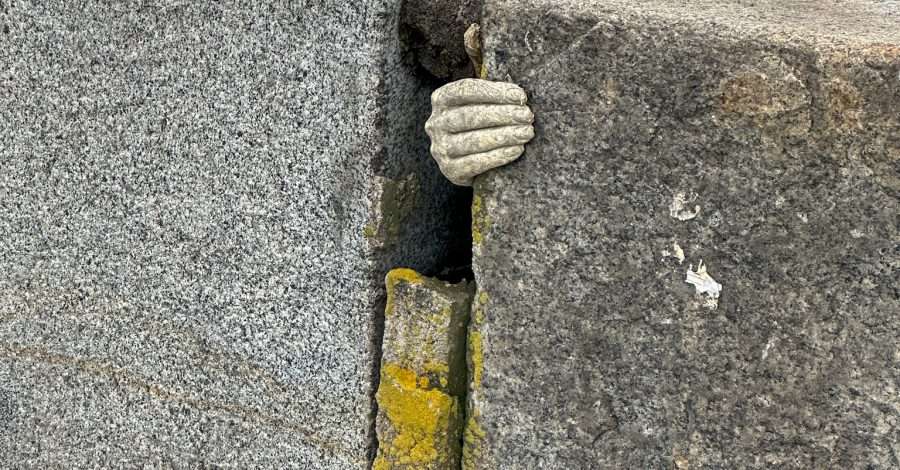 A concrete hand located on a bridge in Wroclaw