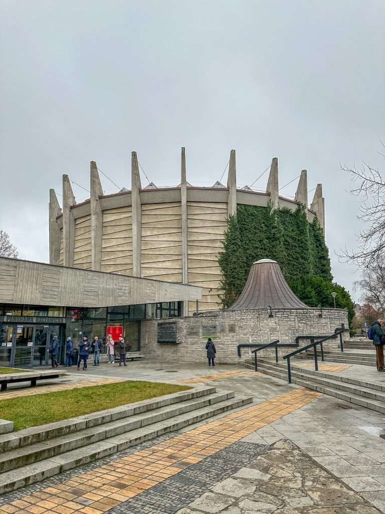 Image shows an external view of the circular building housing the Panorama Racławicka in Wroclaw