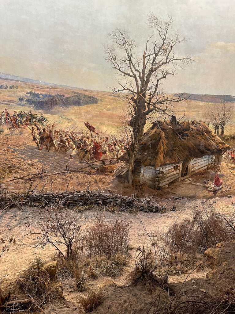 Image shows a scene from the Panorama Racławice in Wroclaw. Visiting this cycloramic painting is definitely one of the best things to do in Wroclaw!